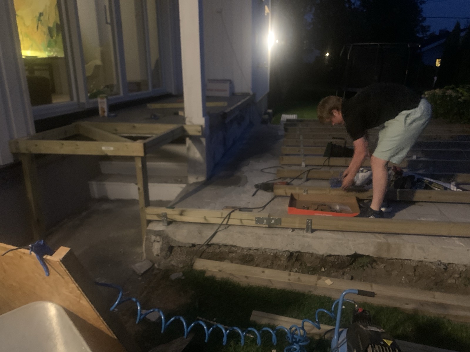 First joists going down, working under a lamp.
