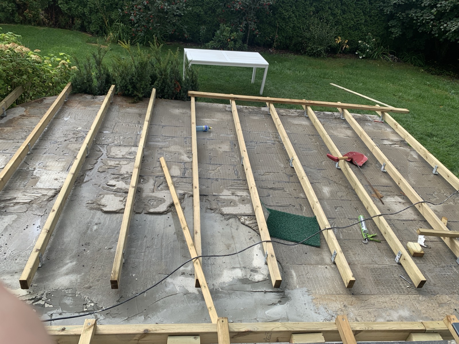 Joists across the old slab. The scarring is where the original tiles came off.